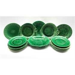 Pair of 19th century Wedgwood green glazed leaf moulded oval shallow dishes W28cm, pair of similar plates on short pedestal foot marked R S and eleven other leaf moulded plates (15) 