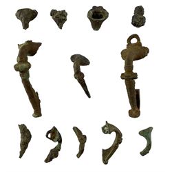Roman British - two large Roman copper alloy trumpet brooches decorated with headstud, loop and collars, together with collection of smaller trumpet brooches and fragments, all circa 1-200 AD (12)