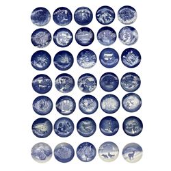 Thirty-five Bing & Grondahl porcelain Christmas plates comprising years 1909, 1921, 1923, 1925, 1934, 1959, 1964 - 1969, 1971 - 1977, 1980, 1981, 1983, 1985 - 1986, 1991 - 1995, 1997 - 2001, together with other Bing & Grondahl plates including Seoul Olympics 1988,'Rebild', 1854-1904 and others, fifteen boxed (52) 