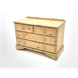Contemporary pine chest, fitted with two short and two long drawers, raised on bracket supports