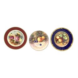 Cabinet plate painted with fruit by James Skerrett with a dark blue and gilt border D28cm, another by the same artist painted with roses with a red border D27cm and another painted with fruit by Leighton Maybury D23cm.  Skerrett and Maybury were previously Royal Worcester artists (3)