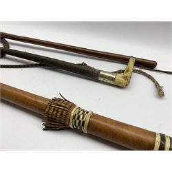 Early 20th century plaited leather riding crop with antler handle and plated collar, a leather bound swagger stick and an African leather bound walking stick (3)