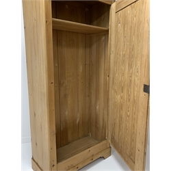 Large pine cupboard, with single fielded panelled door enclosing a shelf, raised on bracket supports, W90cm, H205cm, D48cm
