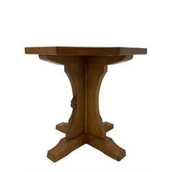 'Mouseman' oak occasional table, octagonal adzed top on cruciform base, carved with mouse signature, on sledge feet, by Robert Thompson of Kilburn