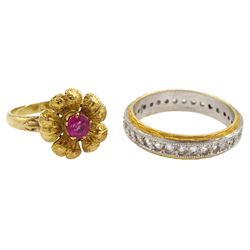 Gold pink stone set flower design ring and a gold clear stone set full eternity ring, both 18ct