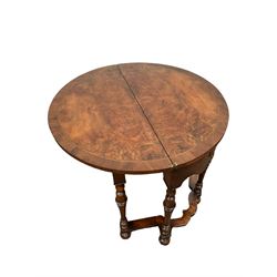 Queen Anne style burr walnut demi lune table, the fold over top over one frieze drawer flanked by two faux drawers, raised on turned supports 