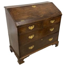 Georgian oak bureau, fall front over two short and two long cock-beaded drawers, on bracket feet