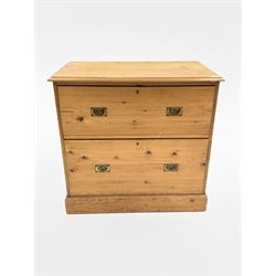 19th century pine campaign style chest, fitted with two deep drawers each with recessed brass pull handles, raised on 