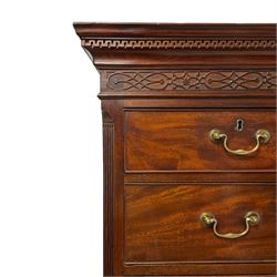 George III mahogany chest-on-chest, projecting moulded cornice over blind fretwork decorated frieze, two short over six long graduating cock-beaded drawers and slide, on bracket feet