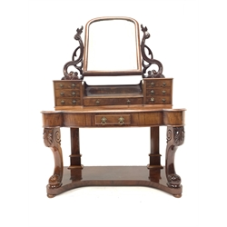 Victorian mahogany duchess dressing table with arched swing mirror over trinket drawers. Serpentine top with frieze drawer, raised on leaf and scroll carved front supports united by under tier. W120cm 