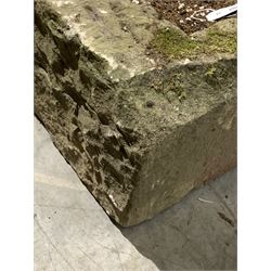 Roughly hewn York stone planter of triangular form (114cm) together with a carved gritstone artefact (52cm)