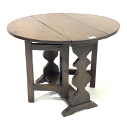 Small late 20th century occasional table, oval drop leaf top, gate action base, shaped end supports on sledge feet, 68cm x 61cm, H50cm