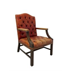 Regency style open armchair, upholstered in buttoned red leather with stud work, moulded arm and front supports 