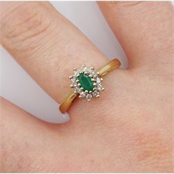 9ct gold oval emerald and round brilliant cut diamond cluster ring, hallmarked