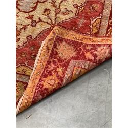 Persian design red ground rug, pole medallion on cream field enclosed by border 105cm x 225cm