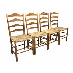 Set four 19th century oak ladder back dining chairs, with rush seats, raised on turned supports and stretchers W47cm