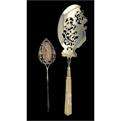 19th century Continental silver fish or pastry server with pierced and chased blade and mother of pearl handle L34cm and another server, the spade shape blade with a figure of Ceres, two pairs of initials and dated 1833 on a turned ebonised handle