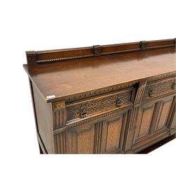 Early 20th century oak sideboard, three drawers with blind tracery work decoration over three panelled cupboards, turned supports connected by stretcher