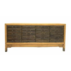 Chinese hardwood multi drawer sideboard, fitted with twenty drawers, raised on stile supports W135cm