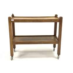 'Mouseman' Yorkshire oak tea trolley, two tiers raised on square supports terminating in castors, carved with mouse signature, 85cm x 38cm, H74cm