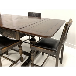 Mid 20th century oak draw leaf dining table, two baluster pedestals on sledge supports connected by flat stretcher and a set of four dining chairs with upholstered drop in seats and backs