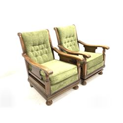 Pair of Early 20th century oak framed rocking chairs, upholstered in green fabric, raised on sprung base W65cm