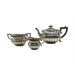 Edwardian silver three piece tea set of rectangular design with gadrooned edge and half body decoration, the teapot with ebonised handle and lift Birmingham 1902/05  Maker William Adams 19oz