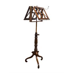 Victorian mahogany rise and fall duet music stand, fitted with a later brass sconce, raised on turned column and three inverted scrolled splayed supports 