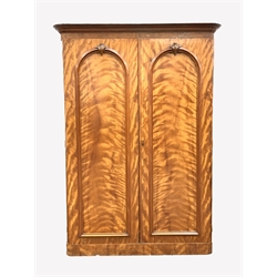  Victorian mahogany double wardrobe, with two arched panelled doors enclosing interior fitted with hooks, four slides and four drawers, W156cm, H216cm, D62cm  