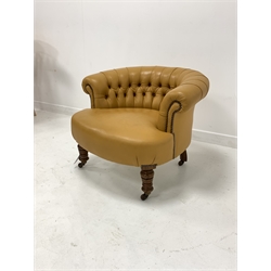 Victorian tub shaped chair upholstered in deep buttoned and studded leather, raised on turned walnut supports and castors 