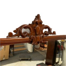 Victorian mahogany mirror back sideboard, carved applied cartouche pediment with extending foliate scrolls over the rectangular mirror plate, fitted with central serpentine cushion drawer over double cupboard with moulded arched panels, flanked by two single cupboards enclosing drawers, sliding trays and shelves