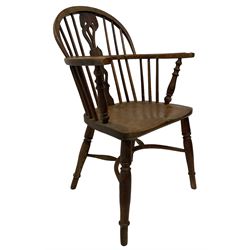 19th century Windsor armchair, the yew wood back and arms over elms seat, raised on tuned supports, united by a crinoline stretcher 