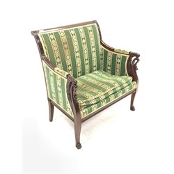 Late 19th century Irish mahogany armchair, with scroll carved crest rail over back seat arms and squab cushion upholstered in green fabric, the arm terminals carved with swans, raised on shaped front supports with paw feet W79cm