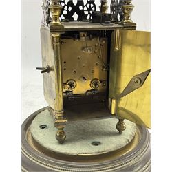 A small early 20th century replica of a 17th century Lantern clock with a French rack striking movement and platform lever escapement striking the hours and half hours on a bell, with a 3-1/2” engraved brass dial, Roman numerals, half-hour markers and inner quarter hour track, steel  Gothic hands, opening rear and side doors, wound and set from the rear, with an associated base and glass dome.
H230cm W90cm  D90cm
