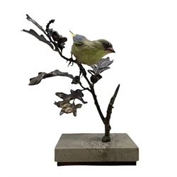 Albany Fine China greenfinch perched on a branch in bronze and porcelain, modelled by David Lovegrove and on a marble base H24cm