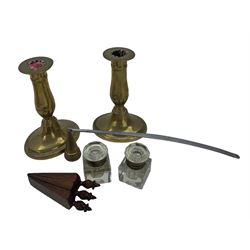 Pair of 19th century brass candlesticks, pair of glass inkwells, three mahogany door wedges, formed as one and a 19th century brass and steel candle snuffer