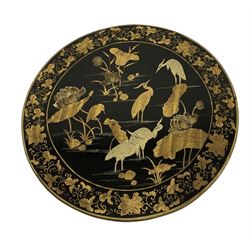 19th century chinoiserie design tilt-top table occasional table, circular top, raised on turned pedestal support with triform base terminating in gilt painted claw feet, black and gold finish with scenes of lotus flowers and birds