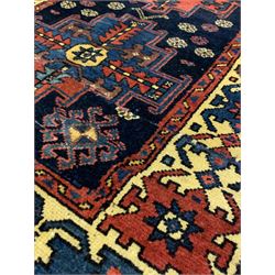 Persian Herriz runner rug of blues reds and browns, triple medallion of geometric designs 210cm x 90cm