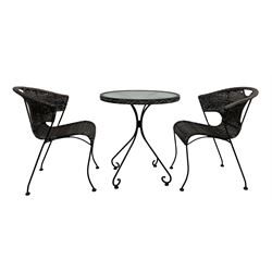 Circular glass and metal conservatory table (D64cm, H72cm); together with two rattan armchairs 