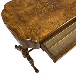 Victorian walnut games table, shaped fold-over and swivel top with chess, cribbage and backgammon boards, single drawer with divisions over sliding well, turned twin pillar base joined by turned stretcher, acanthus carved splayed supports with brass and ceramic castors