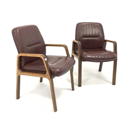  Vaghi - Pair of Italian mid 20th century office armchairs, the oxblood leather upholstered seat and backs raised on polished laminate wood frame, W60cm  