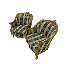 Pair Louis XVI design gilt framed armchairs, the cresting rail carved and moulded with central fleur-de-lis and extending foliate scrolls, scrolled arm terminals decorated with applied acanthus leaves, the apron with cartouche and pierced, raised on cabriole supports, upholstered in foliate patterned green and ivory striped fabric with sprung seat