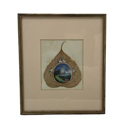 19th century Chinese peepal or sacred fig leaf painting of a lake landscape in an oval panet within a floral surround, framed 18cm x 15cm