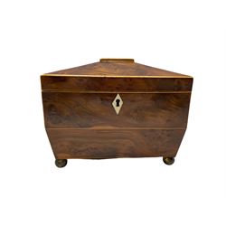 George III burr yew wood sarcophagus shape tea caddy, the interior with two covered containers, ivory escutcheon, metal ring handles and brass ball feet W19cm