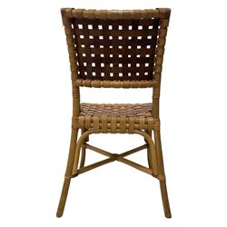 After John McGuire (American 1920-2013) - set of six 20th century bamboo and leather dining chairs, woven tan leather back and seat, on splayed supports united by X-stretcher