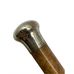 20th century malacca walking cane with silver pommel by Henry Perkins and an ebonised sectional cane inset with a glass tube (2)