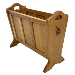 'Unicornman' oak panelled magazine rack, shaped end supports with pierced handles, on side carved with unicorn signature, by Geoff Gell of Coxwold