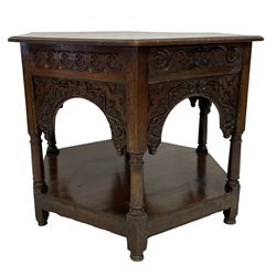 17th century oak centre table, hexagon form, moulded top over cusped and leaf carved frieze, each side with arched panel carved with trailing foliage and berries, on six turned support united by under-tier 