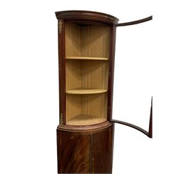 Mid to late 20th century mahogany bow front corner cabinet, glazed door over double cupboard
