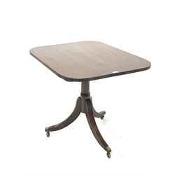 Regency mahogany tilt top occasional table, the rectangular top with rounded corners and reeded edge over ring turned column and reeded triple splay supports with brass cup castors 66cm x 84cm, H70cm